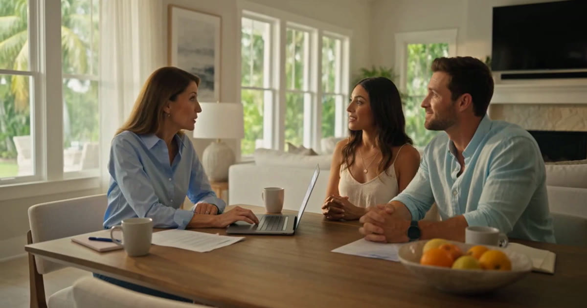 Licensed Florida insurance agent helping a Fort Myers couple compare marketplace health plans on a laptop